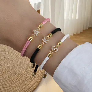 Ensemble de bracelets tressés avec pendentifs lettres en zircone en rose, noir et blanc