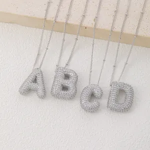 Detail of silver bubble letter pendants A-B-C-D with micro-pave cubic zirconia crystals