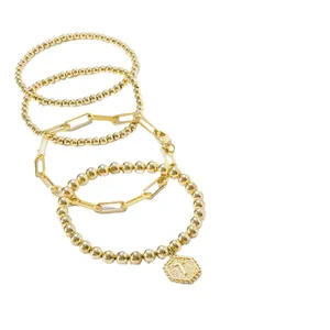 Driedelige gouden armbandset met paperclipketting en hanger met de letter T