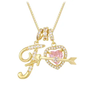 Golden necklace featuring a letter F pendant with pink zircon heart and arrow charms
