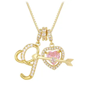 Golden heart necklace with pink gemstone, letter J pendant, and cupid's arrow design