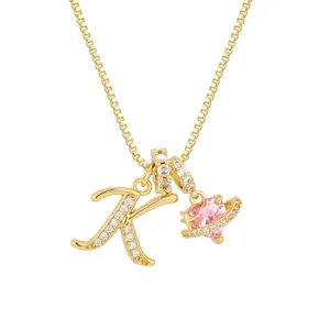 Gold letter K pendant necklace with pink heart-shaped planet zircon stone