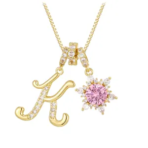 Golden box chain necklace featuring letter K and pink sunflower cubic zirconia pendant