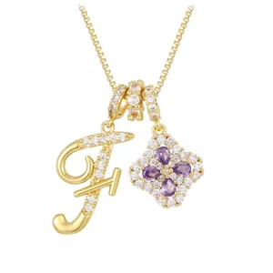 Golden necklace featuring a letter F charm and a purple clover zircon pendant