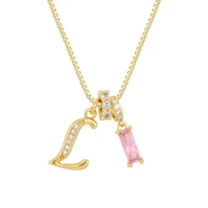 Collar chapado en oro con letra L de cristal y colgante de circonita rosa