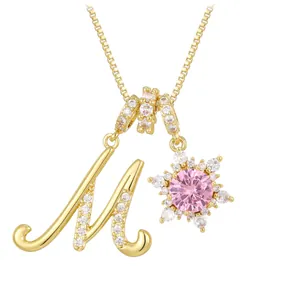 Elegant gold letter M necklace with pink zircon snowflake pendant and crystal inlay