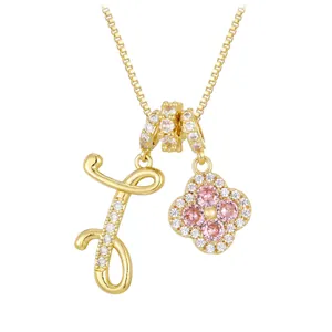 Gold box chain necklace with zircon-paved letter J and pink clover flower charm