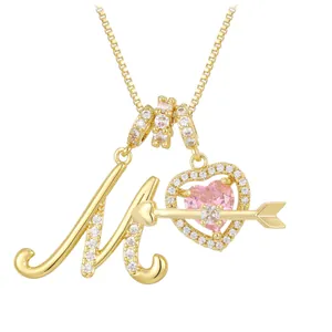 Letter M gold necklace with pink heart zircon and sparkling arrow pendant details