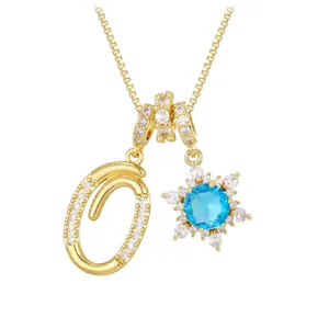 Gold snowflake pendant necklace with letter O and sea blue zircon gemstone