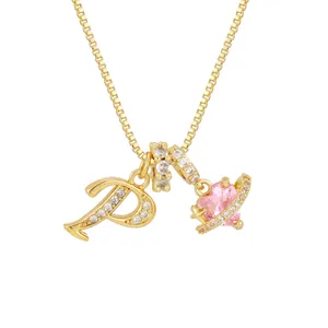 Golden necklace with pink heart gemstone and sparkling letter P pendant charm