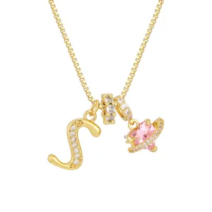 Golden necklace variant featuring a pink heart planet pendant and a diamond-set letter S