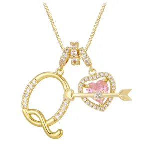 Golden necklace with letter Q and pink heart zircon pendant with Cupid arrow design