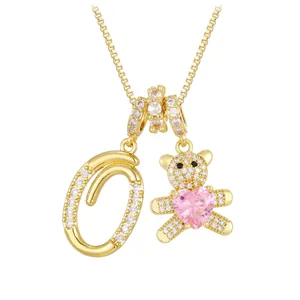 Golden letter O bear necklace with pink heart zircon and sparkling crystal stones