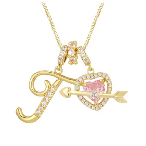 Golden necklace with letter J zircon pendant and pink heart arrow design