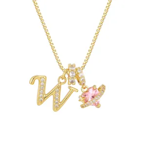 Golden box chain necklace featuring letter W pendant and pink zircon heart planet