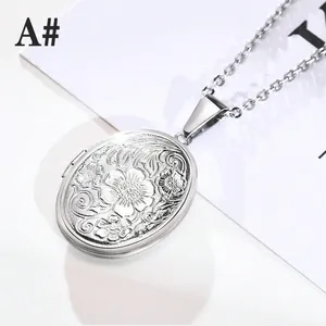 Macro detail of oval locket necklace showing intricate floral relief and hinge mechanism