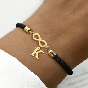 Verstellbares schwarzes Kordelarmband mit goldenem Infinity-Symbol und K-Anhänger