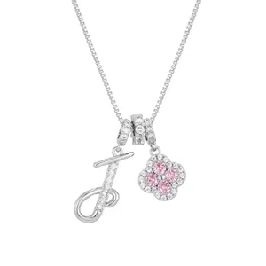 Silver necklace featuring letter J pendant and pink stone clover with micro zircons