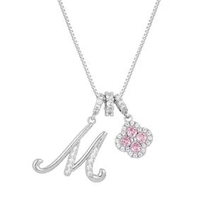 Silver Clover necklace with Letter M pendant featuring pink gemstones and white zircon