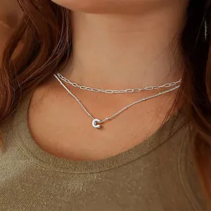 Silver layered necklace featuring an oval link chain and a letter C pendant for women