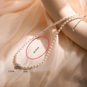 Detailed view of freshwater pearl necklace with silver heart pendant and S925 clasp