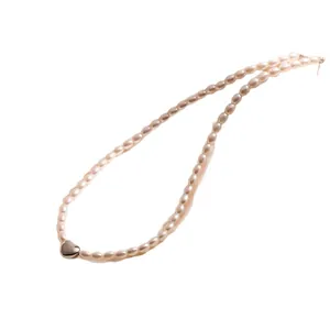 Elegant gold heart pendant necklace with freshwater pearls for a minimalist luxury look