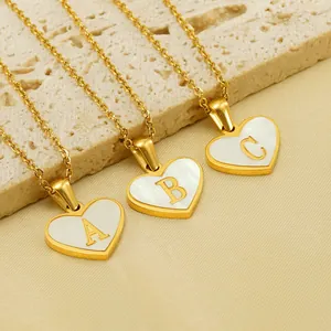 Elegant gold heart shell pendant necklace featuring letters A, B, and C in mother of pearl