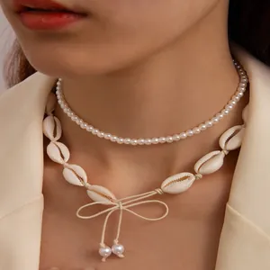 Double-layered Hawaiian style necklace featuring white pearls and natural sea shells