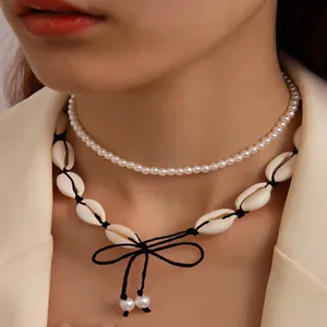 Double-layered Hawaiian beach necklace featuring natural sea shells and round pearls