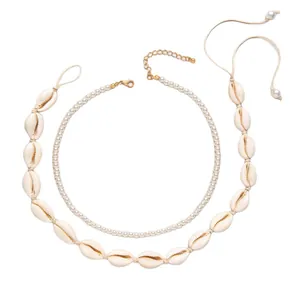 Bohemian layered seashell necklace set with faux pearls and golden accents for beach vacation