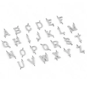 Detailed macro view of 26 silver alphabet beads from A to Z with double hanging loops