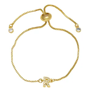 Gold box chain bracelet featuring a cubic zirconia letter R pendant with adjustable slider