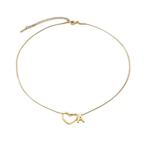 Gold plated snake chain necklace with heart and letter A pendant on white background