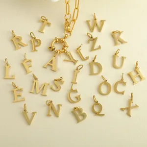 Close-up of golden paperclip chain with 26 alphabets OT buckle pendants on leather