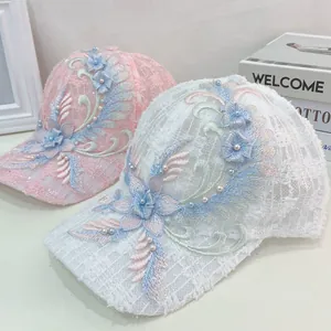 Detailed embroidery of elegant lace flowers and pearls on mesh baseball caps