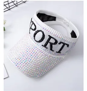 Detail of white knit sun visor featuring shiny rhinestones and SPORT letter embroidery
