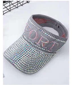 Detail of grey knitted sun visor with rainbow rhinestones and SPORT letter embellishment