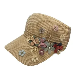 Women's woven sun visor hat featuring decorative floral accents and pearl details
