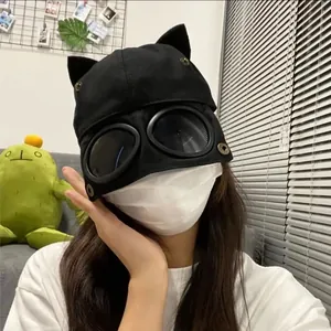 Detail of creative black aviator hat featuring cat ears and integrated dark goggles