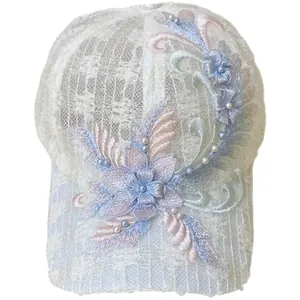 Breathable white mesh baseball cap featuring handmade floral embroidery and pearl accents