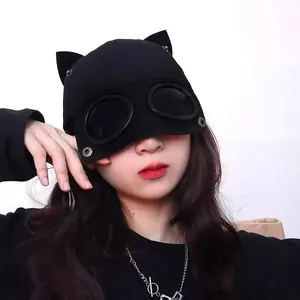 Detail of black aviator baseball cap with cat ears and integrated dark goggles decoration