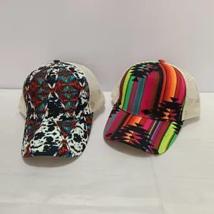 Detail view of printed ponytail baseball caps with breathable white mesh backing