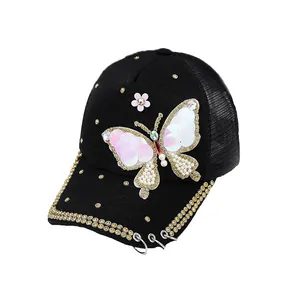 Black sun hat with sequin butterfly, pearls, and rhinestones on mesh baseball cap