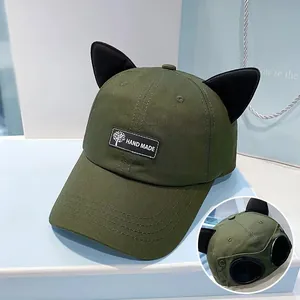 Army green baseball cap with cat ears and rear aviator goggles detail