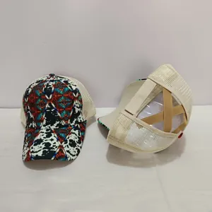 Detail showing elastic criss-cross straps for high ponytails on a mesh trucker hat