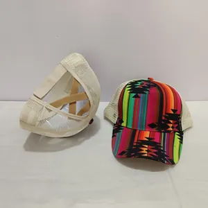 Detail of white mesh trucker hat with elastic criss-cross ponytail hole and striped pattern