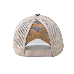 Detail of high ponytail trucker hat featuring criss-cross elastic bands and mesh texture
