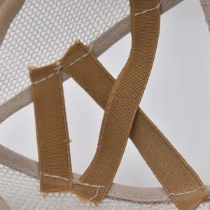 Detail of cross elastic bands and fine mesh back on khaki ponytail baseball cap