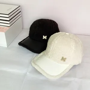 Winter fleece baseball cap with leather brim and rhinestone M letter ornament