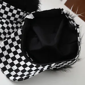 Interior detail of black and white checkerboard wig hat with 100% cotton lining and label